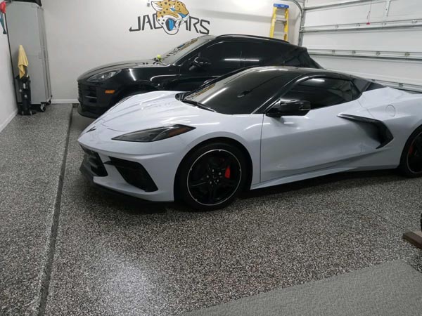 Two cars are parked on a newly coated 1-day garage floor surface in Jacksonville