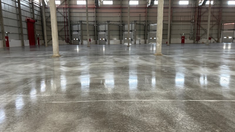Epoxy coated floor inside a large industrial warehouse