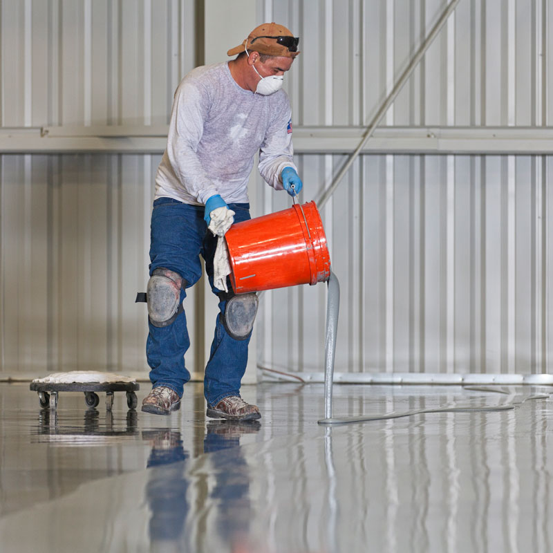 Pouring epoxy coating on industrial concrete floor in Jacksonville and St. Augustine, FL